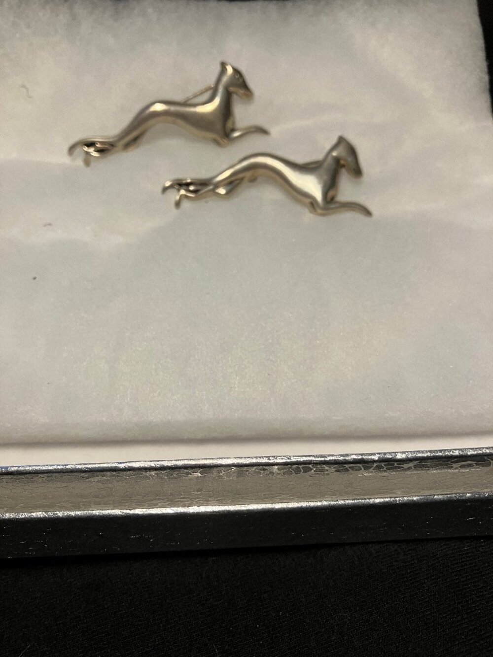 Two rlunning or leaping stylized greyound brooches, Steriing silver,